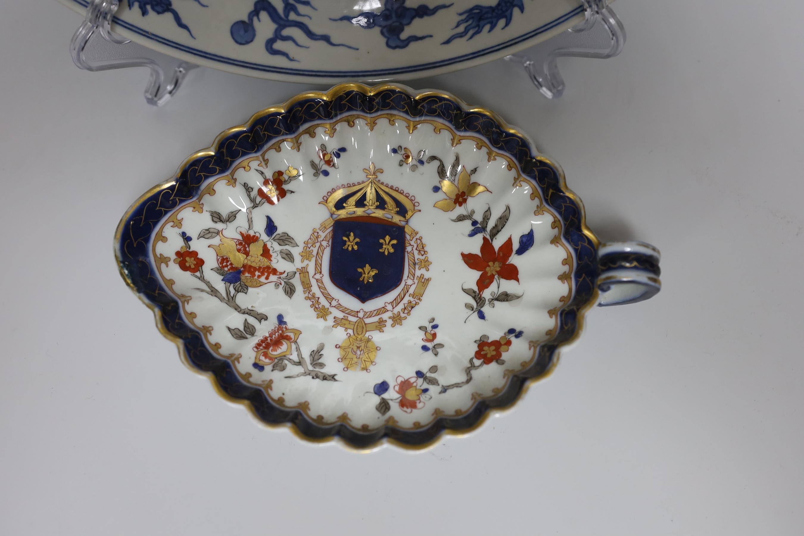 A Chinese blue and white ‘dragon’ dish, marked to base, 28cm diameter, together with a Samson blue and white ground serving dish with gilt decoration